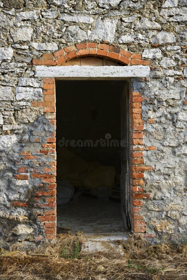 Doorway into stone building in Tuscany. stock image