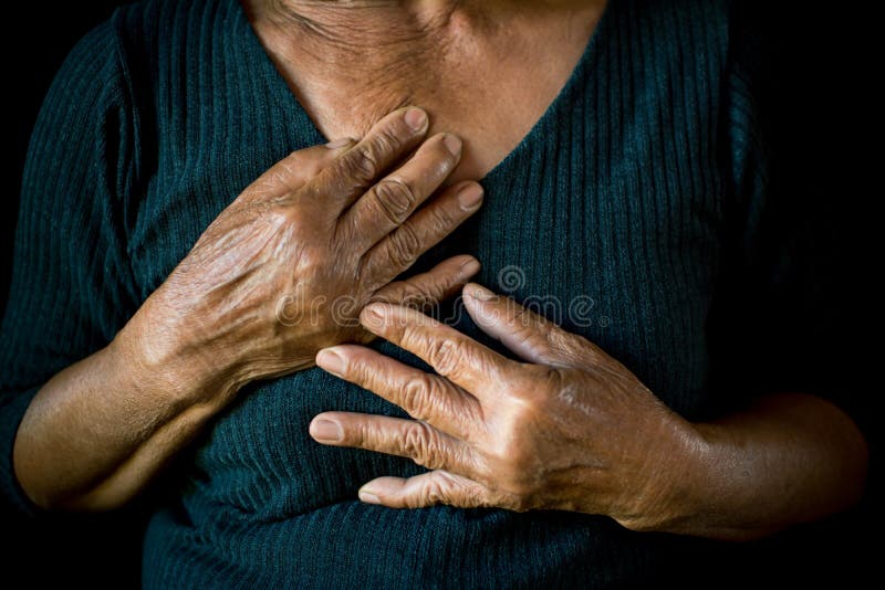 Old woman felt heart ache on black background,Illness of the elderly problem concept. Old woman felt heart ache on black background,Illness of the elderly problem concept