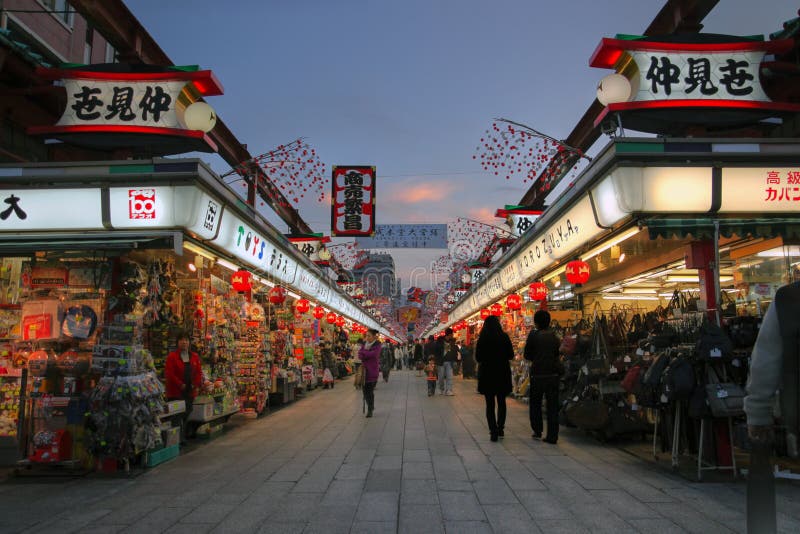 Nakamise dori (dori=street) is a commercial walkway leading to the Senso-ji temple in Asakusa district of Tokyo, Japan. They are mostly selling traditional wares, including specialist in fans, dolls, kimonos, obi saches, haircombs etc. HDR image taken at sunset time. Editorial image. Nakamise dori (dori=street) is a commercial walkway leading to the Senso-ji temple in Asakusa district of Tokyo, Japan. They are mostly selling traditional wares, including specialist in fans, dolls, kimonos, obi saches, haircombs etc. HDR image taken at sunset time. Editorial image.