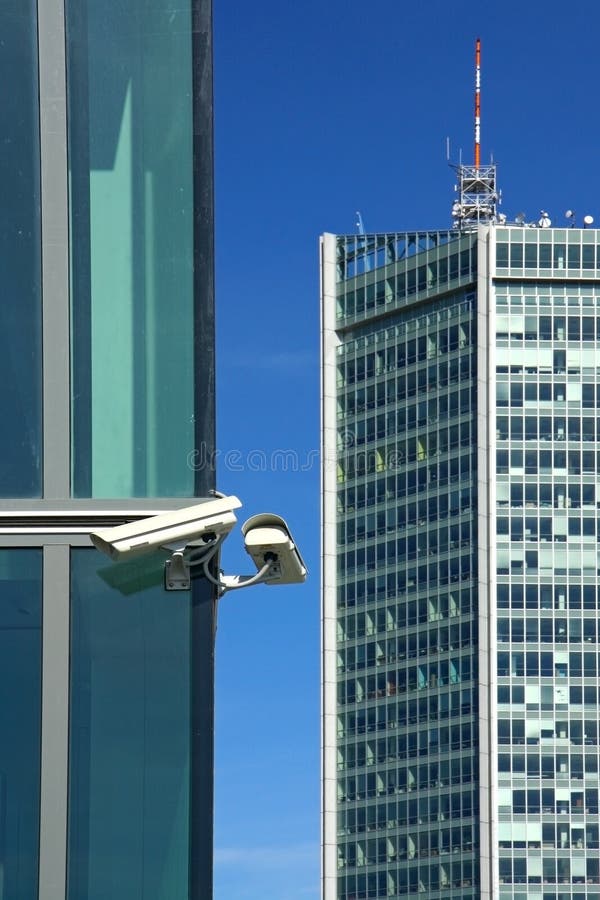 Two sec cameras on glass facade and sky. Two sec cameras on glass facade and sky