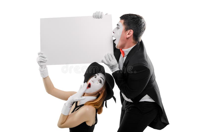 Dos imita llevando a cabo el cartel en blanco imagen de archivo libre de regalías Dos imita llevando a cabo el cartel en blanco imagen de archivo libre de regalías