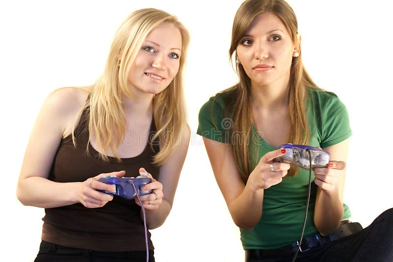 Dos muchachas que juegan a los juegos video imagen de archivo libre de regalías Dos muchachas que juegan a los juegos video imagen de archivo libre de regalías