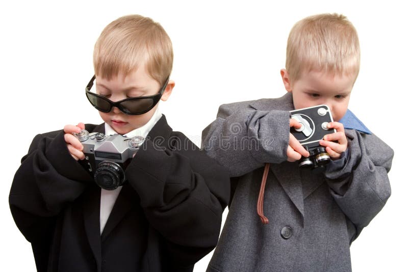 Two boys in business wear with cine and photo cameras. Two boys in business wear with cine and photo cameras