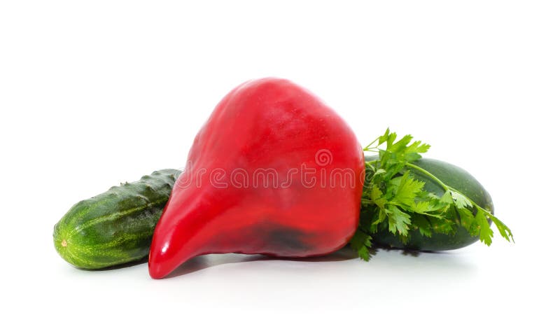 Two ripe cucumbers and red pepper isolated on white background. Two ripe cucumbers and red pepper isolated on white background