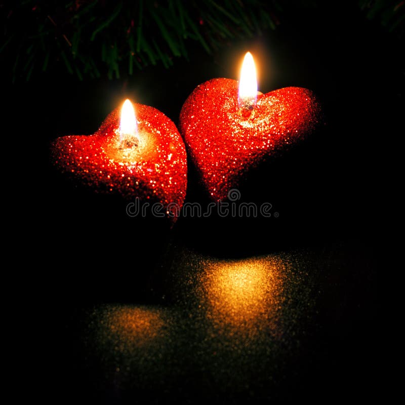 Dos velas en forma de corazón imagen de archivo Dos velas en forma de corazón imagen de archivo