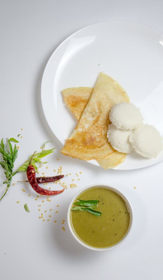 Dosa, idli with sambar and dal in white background for indian dinner or breakfast