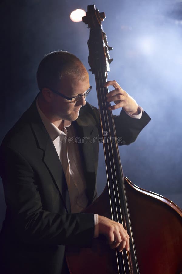 Man Playing Double Bass stock image. Image of instrument 31835539