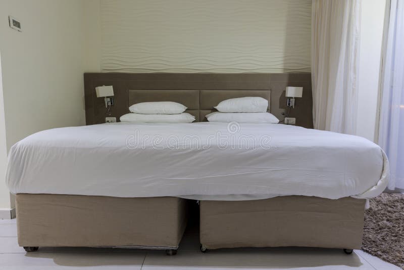 Double bed in a hotel room stock image. Image of hotel 70391551