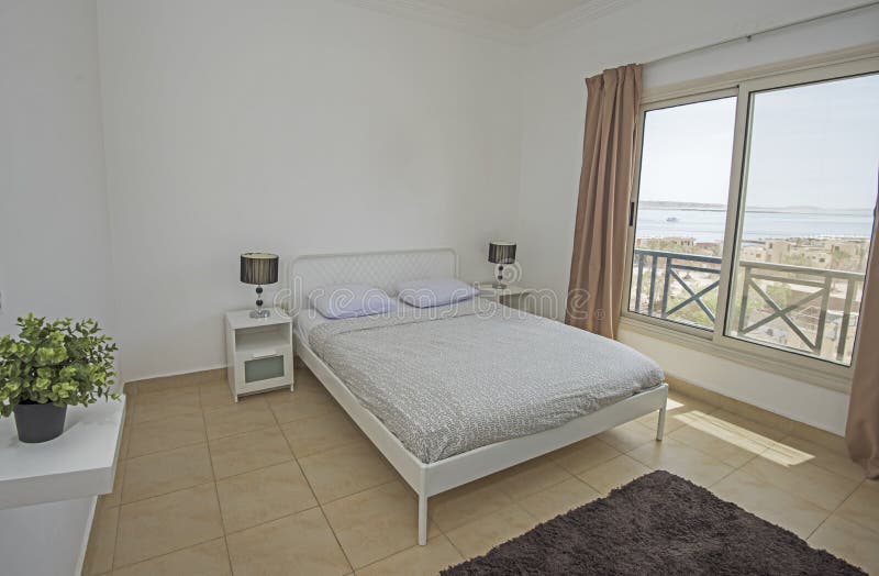 Double bed in a luxury apartment with sea view