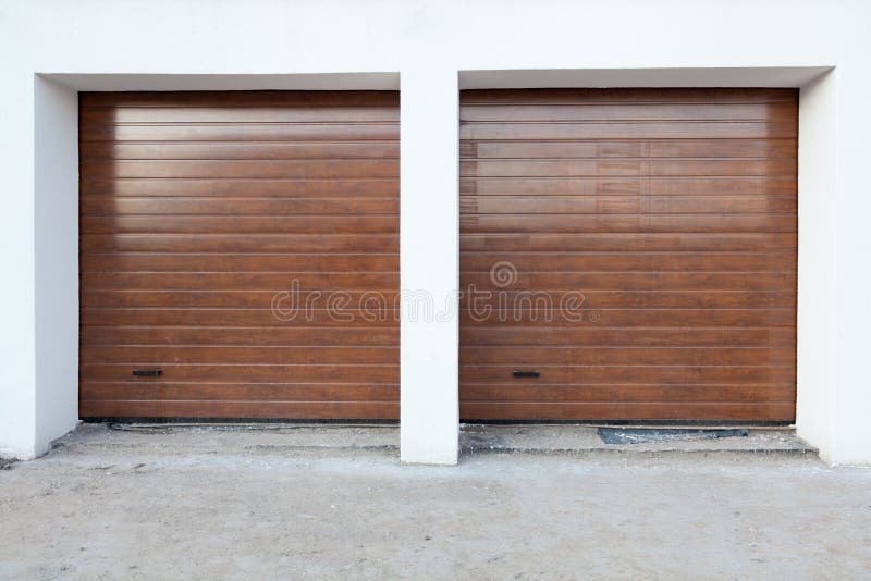Double Brown Garage Door in a New House. Stock Image Image of cement
