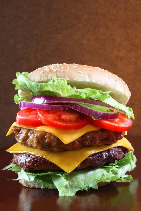Fully loaded Double cheeseburger with fresh lettuce. Crispy diet stock images, royalty-free photos and pictures