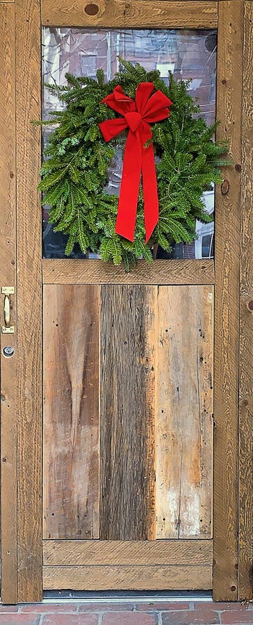 Unique Wood Door in an Historic Town Decorated for the Christmas Holidays