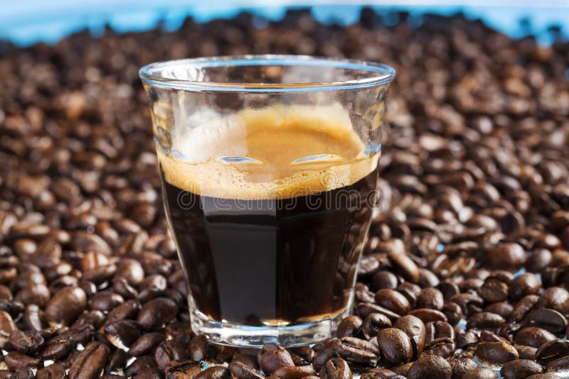 A Cup of Double Espresso Coffee with Nice Flower Design in it Stock