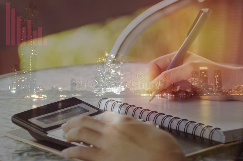 double exposure of Businesswoman Hand Calculating Invoice Using Calculator At Desk In Office and nigt city, concept in finance, account and capital banking. double exposure of Businesswoman Hand Calculating Invoice Using Calculator At Desk In Office and nigt city, concept in finance, account and capital banking