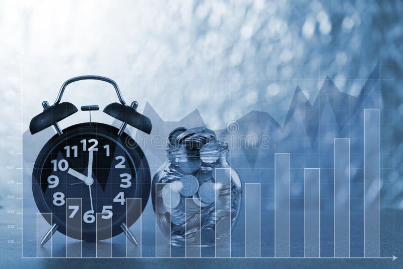 Double exposure of alarm clock and step of coins stacks with coin in glass jar with financial graph, time for savings money stock image