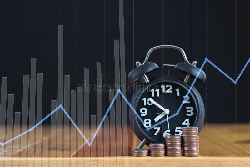 Double exposure of alarm clock and step of coins stacks on working table with financial graph, time for savings money concept. stock images