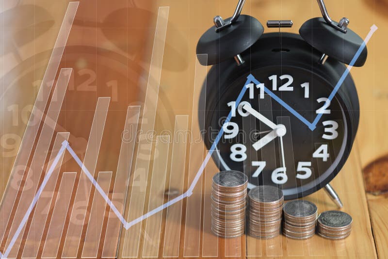 Double exposure of alarm clock and step of coins stacks on working table with financial graph chart, time for savings money stock image