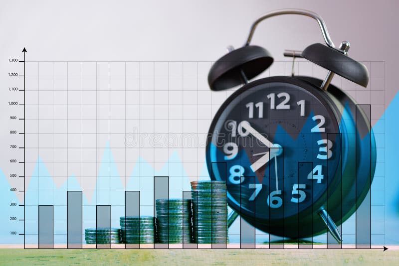 Double exposure of alarm clock and step of coins stacks on working table with financial graph, time for savings money concept. royalty free stock images
