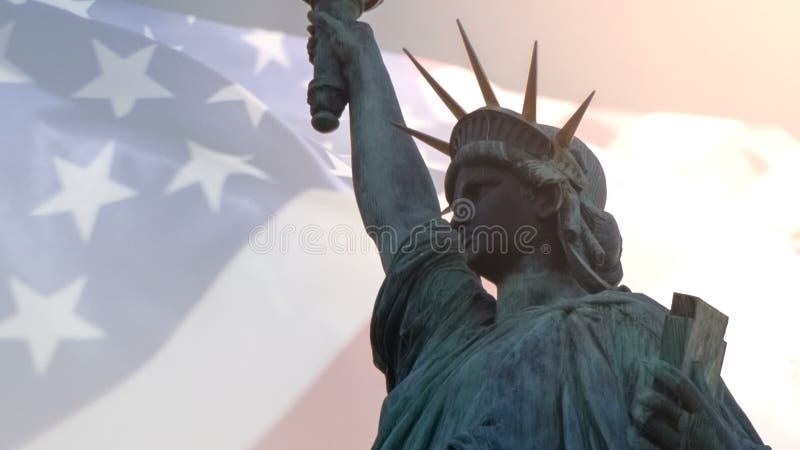 Double exposure with American flag waving and statue of liberty for Memorial Day or Independence Day
