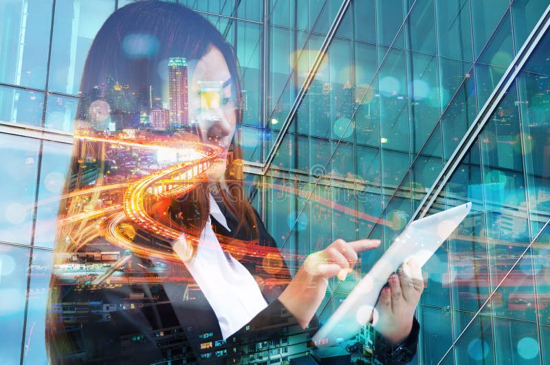 Double Exposure of Business Woman use Wireless Digital Mobile Tablet with Expressway or Highway in Modern city with Bokeh as Business Technology Telecommunication Concept.