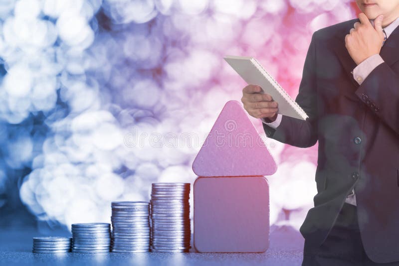 Double exposure of businessman read report with Model house wood royalty free stock photography