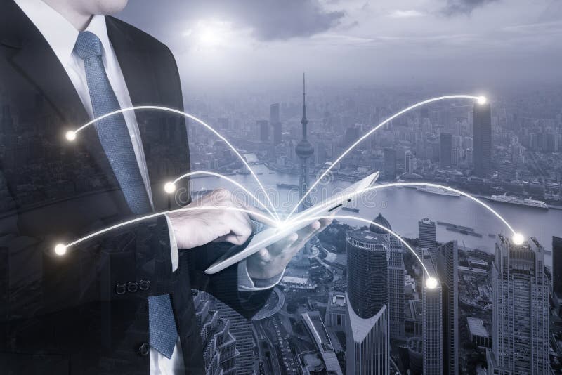 Double exposure of businessman using digital tablet pc royalty free stock image