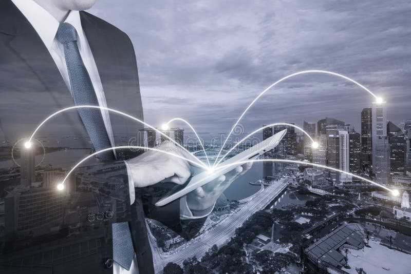 Double exposure of businessman using digital tablet pc royalty free stock photo