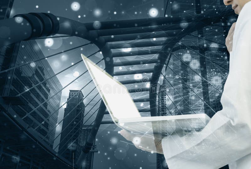 Double exposure-doctor holds laptop in hand,background lines and dot technology and cityscape, concept of medical science and royalty free stock photography Double exposure-doctor holds laptop in hand,background lines and dot technology and cityscape, concept of medical science and royalty free stock photography