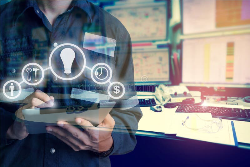 Double exposure of Engineer or Technician man with business industrial tool icons while using tablet with monitor of computers stock images Double exposure of Engineer or Technician man with business industrial tool icons while using tablet with monitor of computers stock images