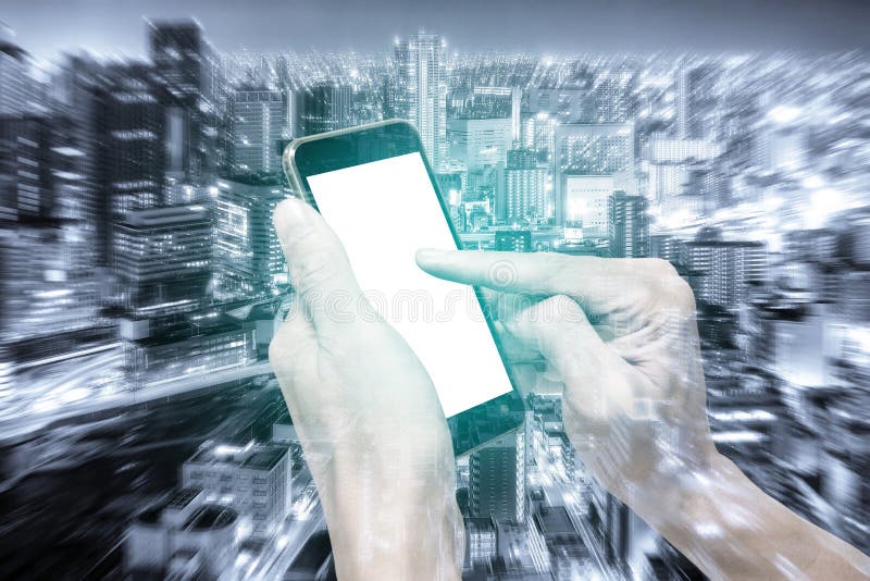 Double exposure hands using smartphone and city stock images