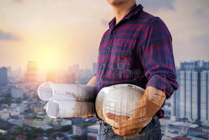 Double Exposure Image of Construction Worker Holding Safety Helmet and Construction Drawing