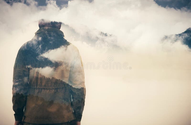 Double Exposure of Man and Cloudy Mountains forest