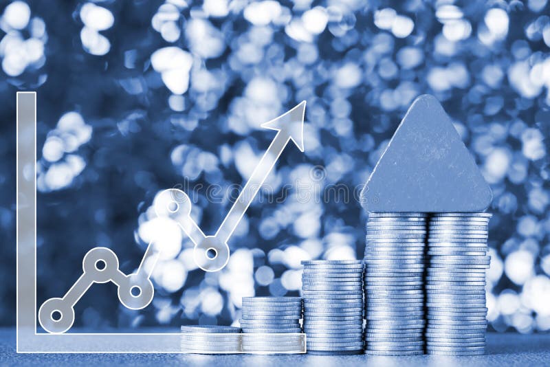 Double exposure of model house wood form with step of coins stack with financial graph, real estate investment and saving banking royalty free stock photography