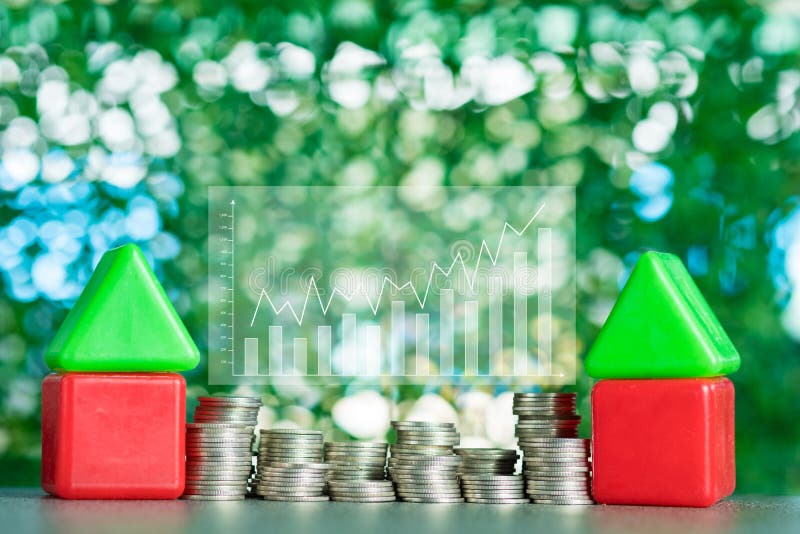Model house wood form with step of coins stack on table, real es royalty free stock photo
