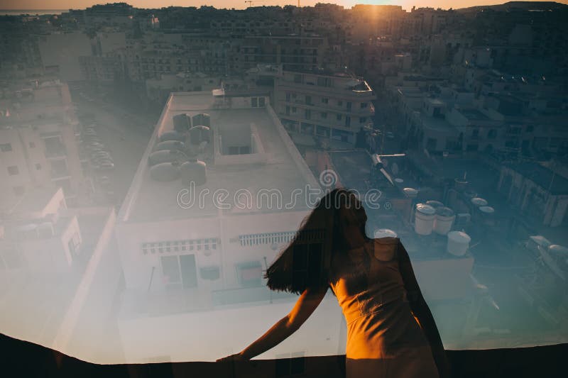 Double exposure (girl looking at the sunset)