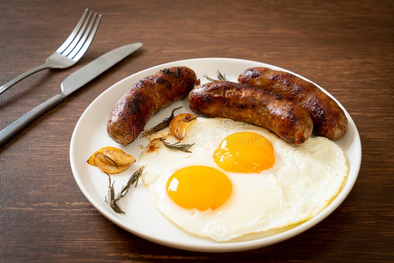 Double Fried Egg with Pork Sausage Stock Photo - Image of plate ...