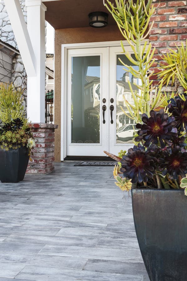 Double front door of a brick home