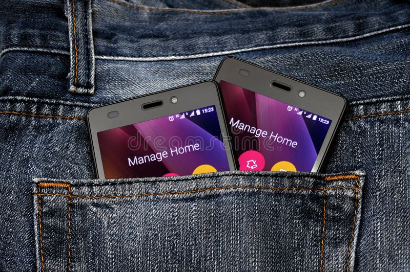 Double Mobile Phone, Cellphone In Back Pocket Blue Jeans Stock Photo