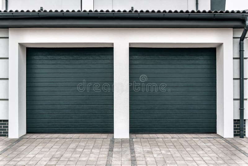 Modern and Luxurious Double Garage with Driveway and Roller Door Stock