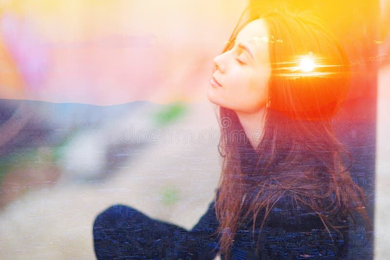 Double multiply exposure portrait of a dreamy cute woman meditating outdoors with eyes closed, combined photograph of nature