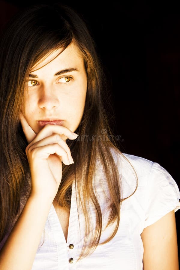 Young beautiful woman concerned about something. Woman doubtful looking stock images, royalty-free photos and pictures