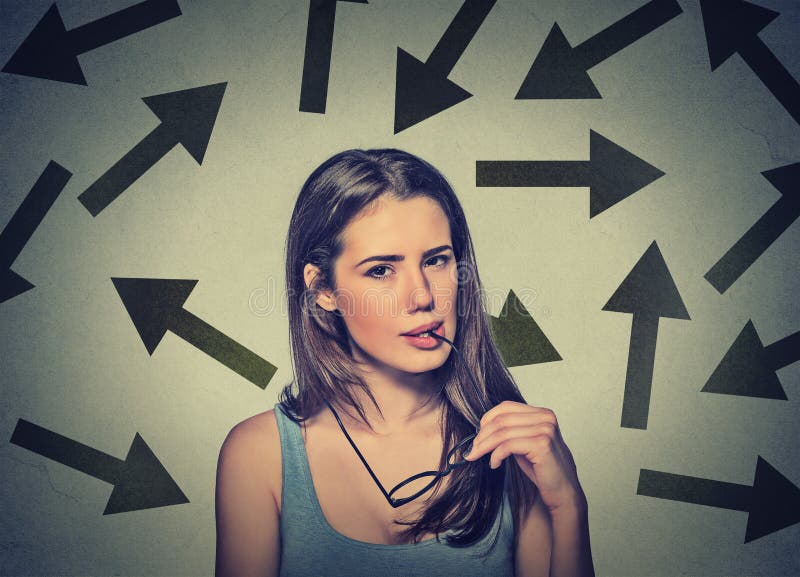 Doubtful confused skeptical young woman on gray wall background. Human face expression reaction perception. Woman doubtful looking stock images, royalty-free photos and pictures