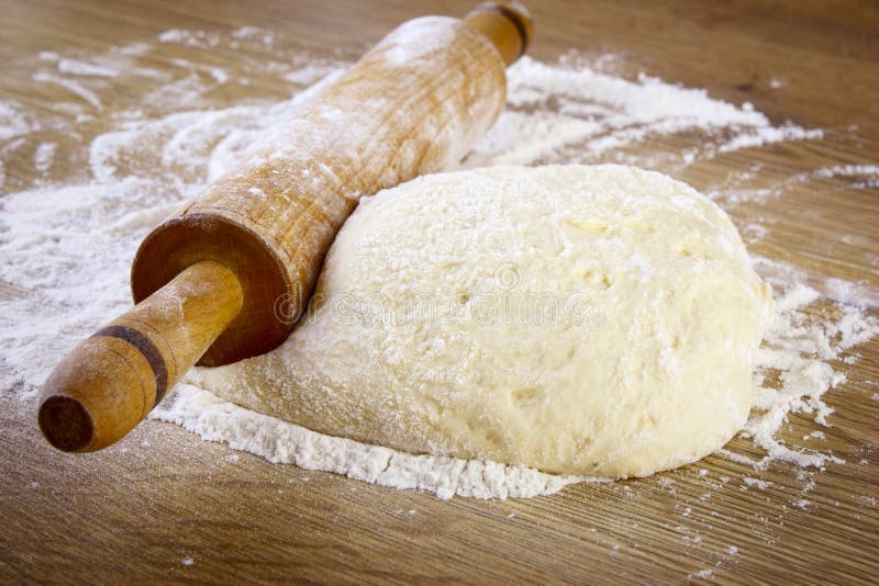 Dough and rolling pin stock photo