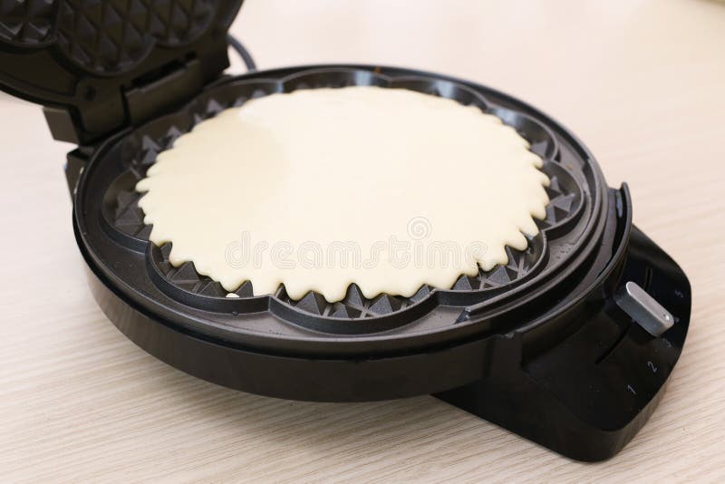 Dough on waffle iron stock image. Image of product, cooked 60584989