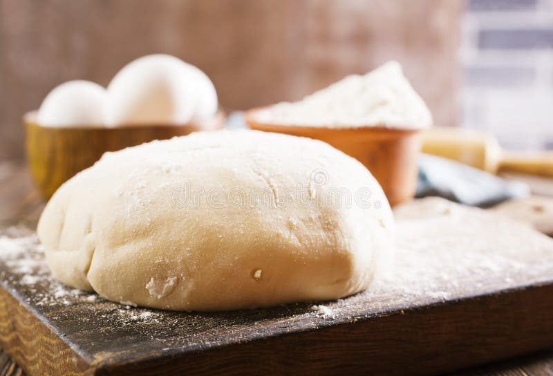 Dought and ingredients, fresh dought on a table. Dought stock images, royalty-free photos and pictures