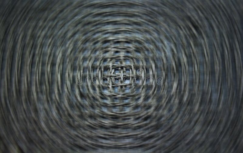 A motion swirl made by spinning fibers. Concept of industry, motion, captivity, or stress. A motion swirl made by spinning fibers. Concept of industry, motion, captivity, or stress.