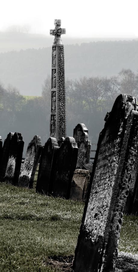 Chilly image of the graveyard featured in Bram Stoker's Dracula on the clifftop overlooking Whitby harbour in North Yorkshire, England. Ancient pagan celtic images stock images, royalty-free photos and pictures