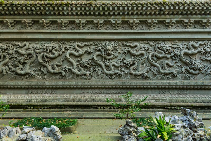 Dragon carving on the wall at the Buddhist Fayu Temple in the Putuoshan mountains, Zhoushan Islands,  a renowned site in Chinese