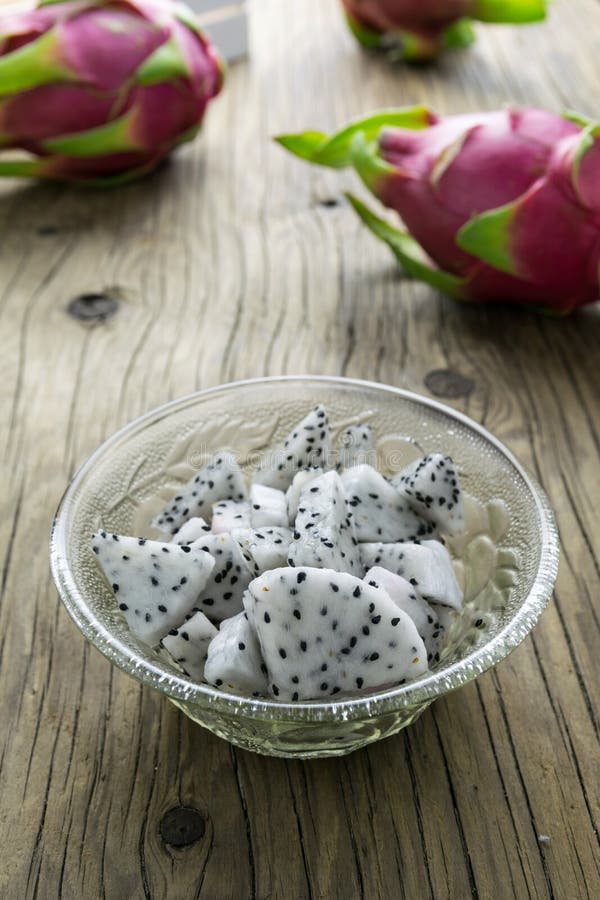 Dragon Fruit in the bowl on the wooden table, Selective focus. stock photography