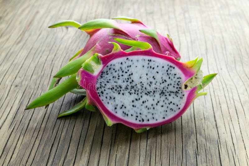 Dragon Fruit On old Wooden Table stock photos
